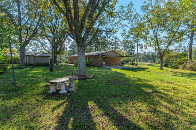 18040 US Highway 331 N, Defuniak Springs, FL 32433 - view of green lawn with a patio