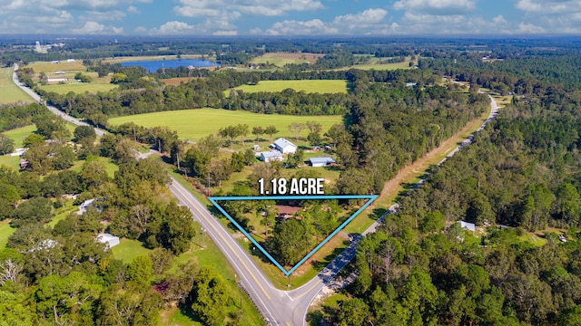 18040 US Highway 331 N, Defuniak Springs, FL 32433 - aerial overview of property's location with property parcel outlined, a heavily wooded area, and a nearby body of water