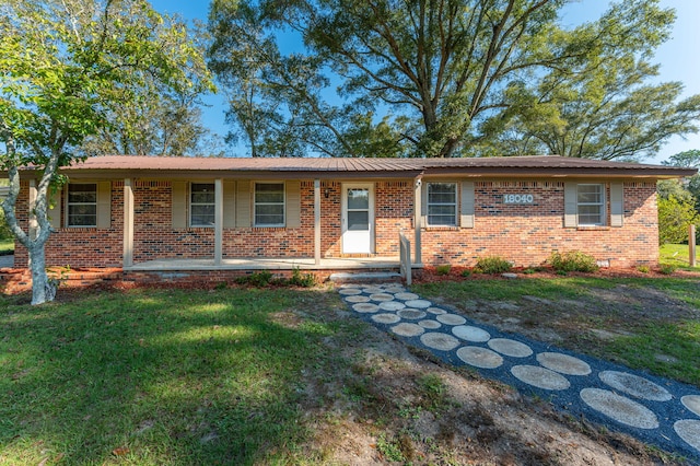 18040 US Highway 331 N, Defuniak Springs, FL 32433 - single story home featuring covered porch, a front yard, and brick siding
