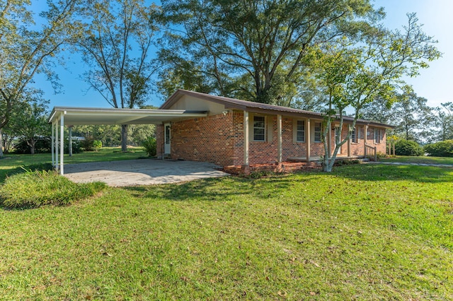 ranch-style home featuring a carport and a front yard