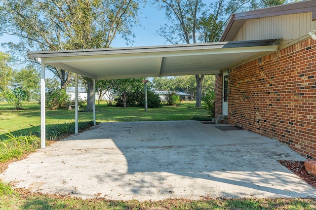 view of parking with a carport and a lawn