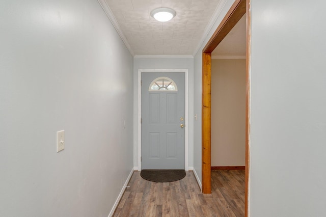 doorway to outside with crown molding and hardwood / wood-style floors