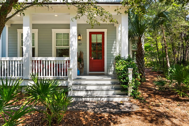 property entrance featuring covered porch