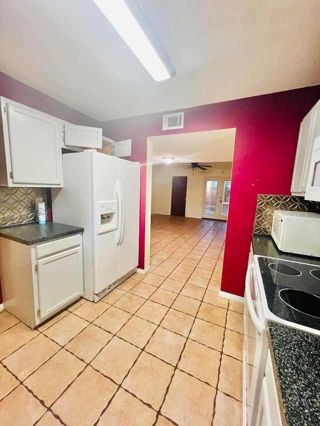 kitchen with decorative backsplash, white cabinets, ceiling fan, light tile patterned floors, and white appliances