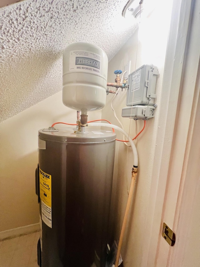 utility room with water heater