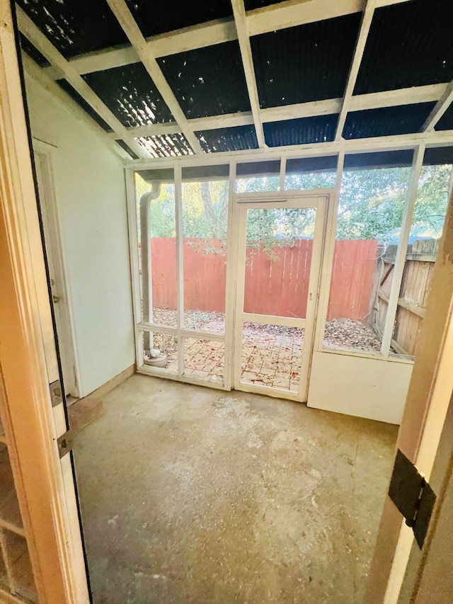 unfurnished sunroom featuring plenty of natural light