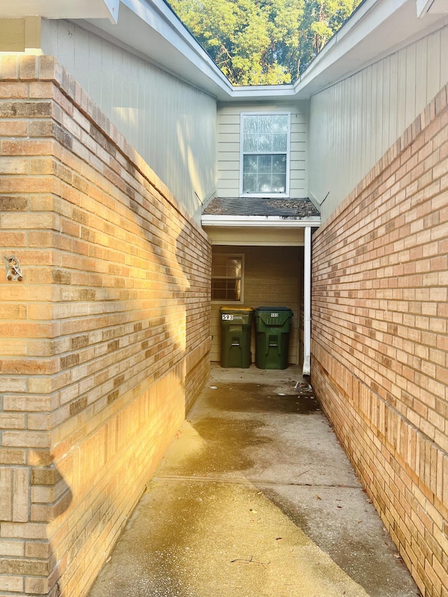 view of property exterior featuring brick siding