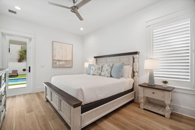 bedroom featuring light wood-style flooring, multiple windows, visible vents, and access to exterior