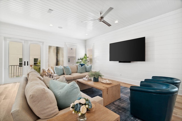 living area featuring wooden ceiling, visible vents, french doors, and wood finished floors