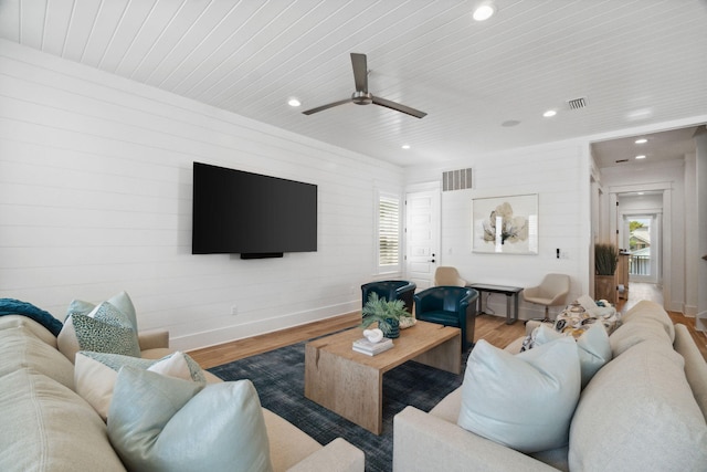 living room with ceiling fan, hardwood / wood-style floors, and wooden ceiling