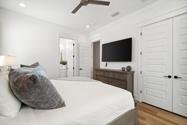 bedroom featuring recessed lighting, visible vents, a closet, light wood-type flooring, and crown molding