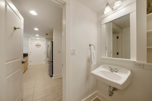 bathroom with tile patterned flooring