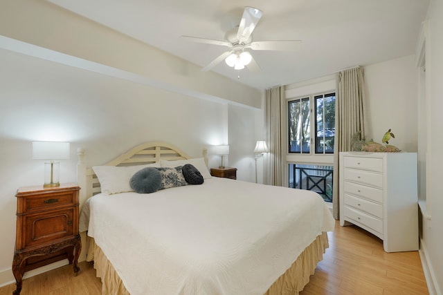 bedroom with light hardwood / wood-style flooring and ceiling fan