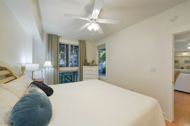 bedroom with ceiling fan and light wood-type flooring