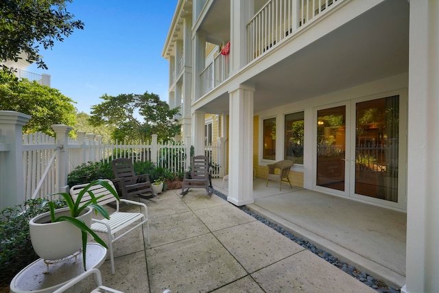 view of patio featuring a balcony