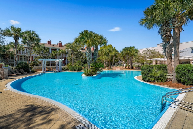 view of pool with a pergola and a patio