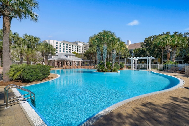 view of swimming pool with a patio area and a pergola