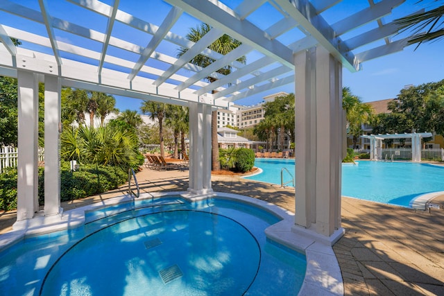 view of swimming pool with a patio and a pergola