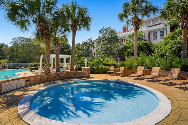 view of swimming pool with a patio area