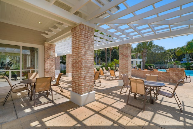 view of patio featuring a pergola and a swimming pool