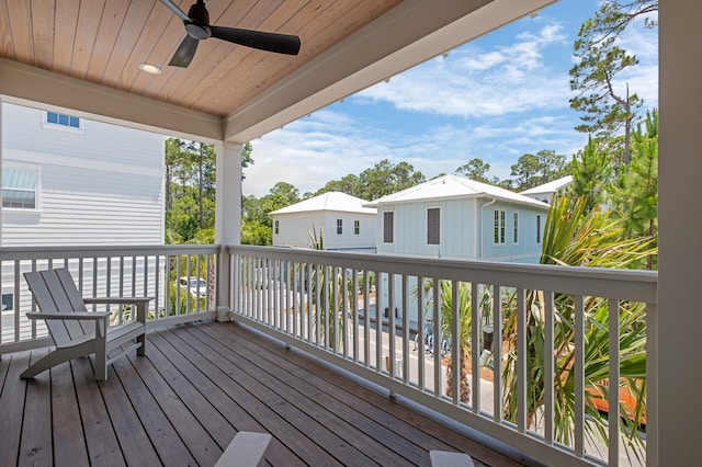 wooden deck featuring ceiling fan