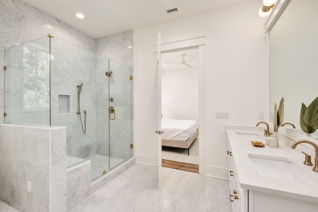 bathroom with ceiling fan, vanity, and a shower with shower door