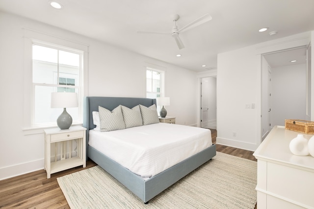 bedroom with ceiling fan and wood-type flooring