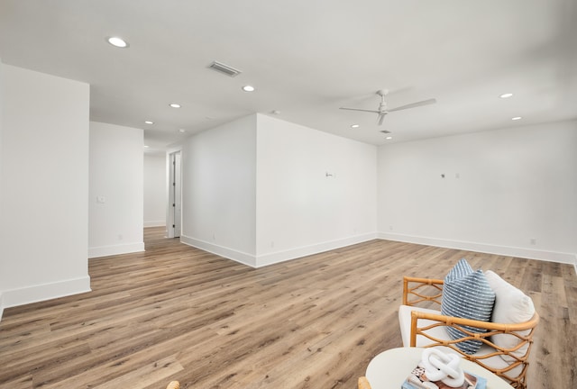 interior space with light wood-type flooring and ceiling fan