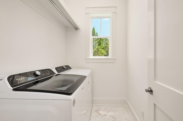 washroom with independent washer and dryer