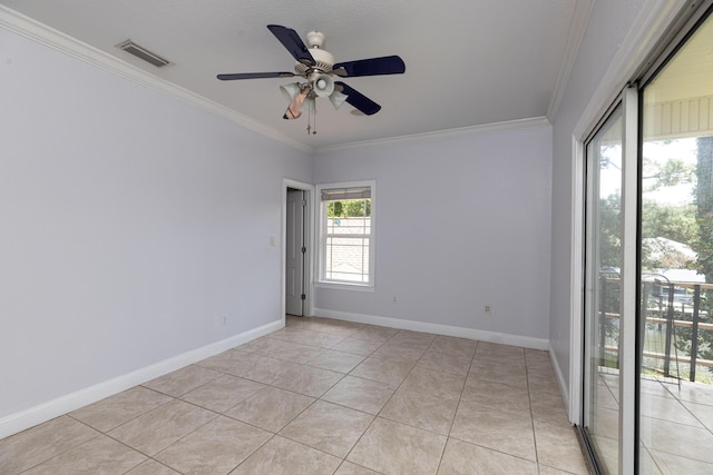 tiled spare room with ceiling fan and ornamental molding