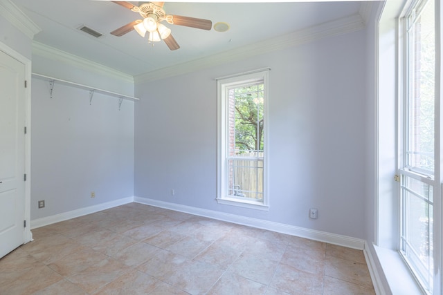 unfurnished room with ceiling fan and ornamental molding