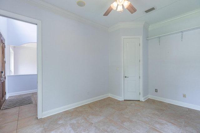 empty room featuring crown molding and ceiling fan