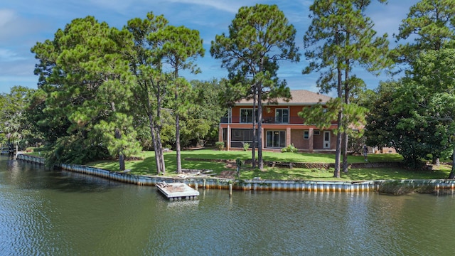 exterior space with a lawn and a water view