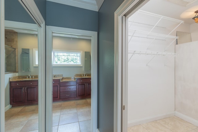 bathroom with vanity, tile patterned floors, a shower with shower door, and crown molding