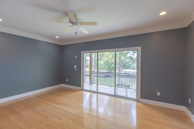 empty room featuring ceiling fan, light wood-type flooring, and ornamental molding