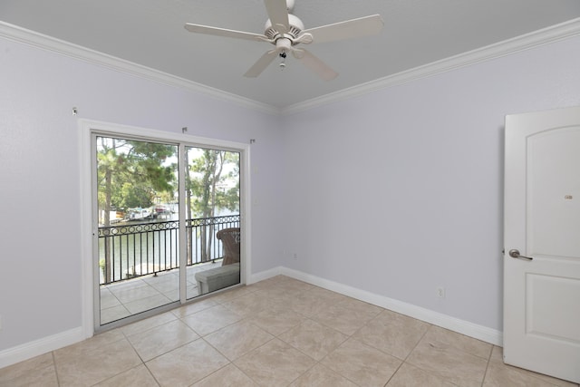 tiled spare room featuring a water view, ceiling fan, and crown molding