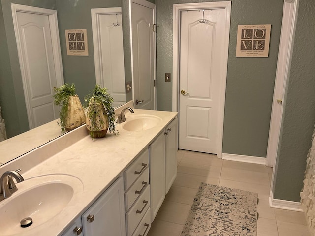 bathroom with vanity and tile patterned floors