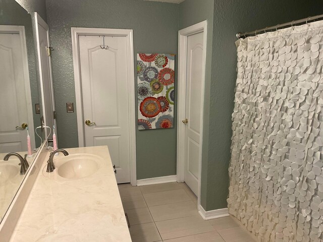 bathroom with vanity and tile patterned floors