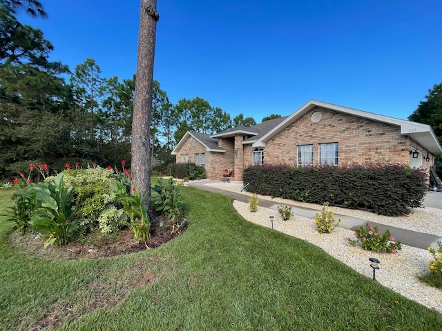 view of front of home with a front lawn