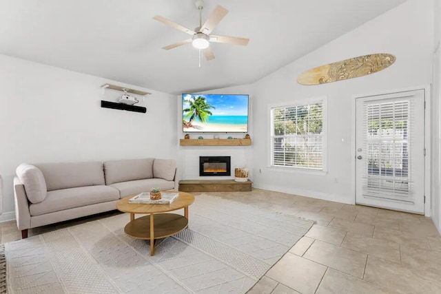 tiled living room featuring ceiling fan and vaulted ceiling