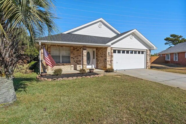 ranch-style home with a garage, a front lawn, and covered porch