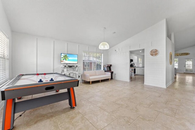 recreation room featuring lofted ceiling