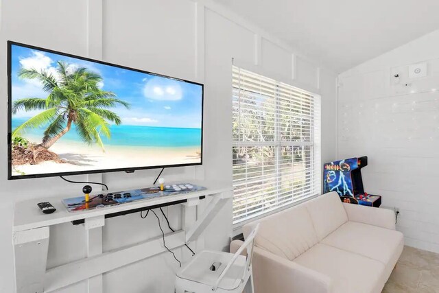 home office featuring lofted ceiling