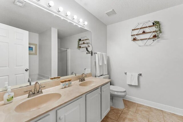 full bathroom featuring shower with separate bathtub, vanity, tile patterned flooring, toilet, and a textured ceiling