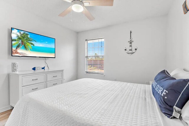 bedroom featuring light hardwood / wood-style flooring and ceiling fan