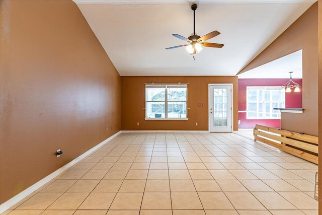 3968 Hickory St, Niceville, FL 32578 - spare room with light tile patterned floors, baseboards, a ceiling fan, and vaulted ceiling