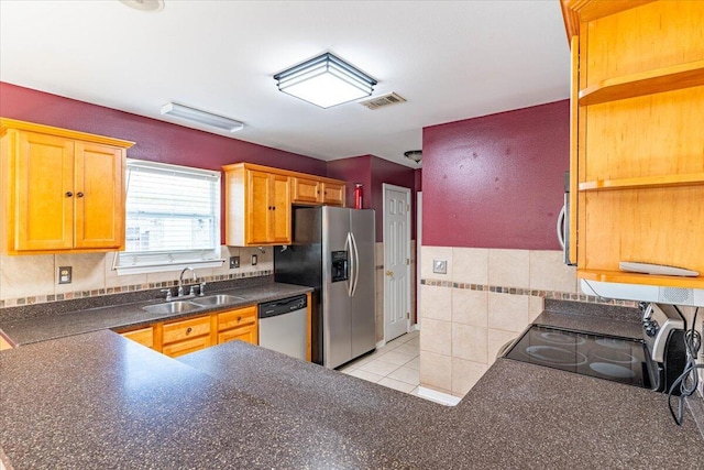 3968 Hickory St, Niceville, FL 32578 - kitchen with light tile patterned flooring, dark countertops, appliances with stainless steel finishes, a sink, and visible vents
