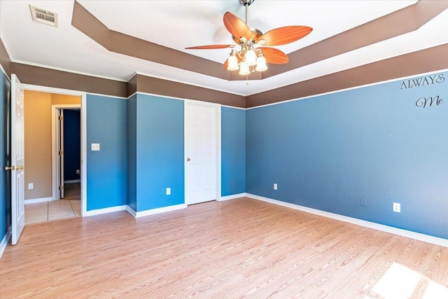 3968 Hickory St, Niceville, FL 32578 - empty room featuring baseboards, a ceiling fan, wood finished floors, and visible vents