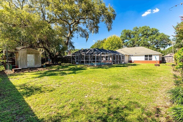 3968 Hickory St, Niceville, FL 32578 - view of yard featuring a storage shed, an outdoor structure, a fenced backyard, and glass enclosure