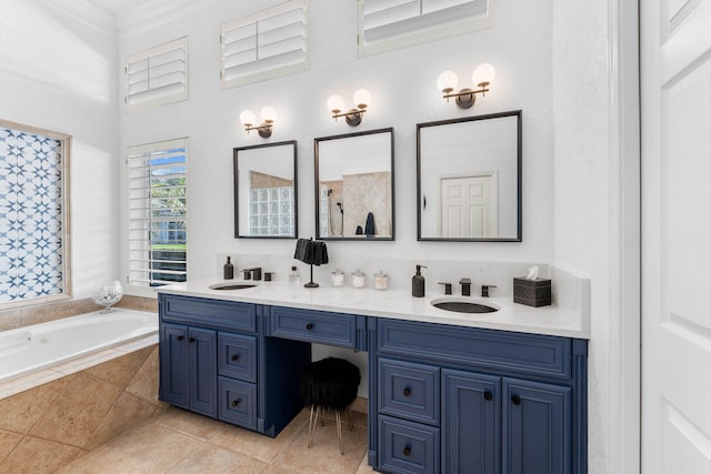 bathroom with tiled tub, vanity, crown molding, and tile patterned flooring